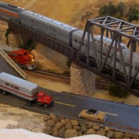 Looking down at the traffic heading to Laurel Gulch on the river road, with the CA Zephyr crossing the bridges